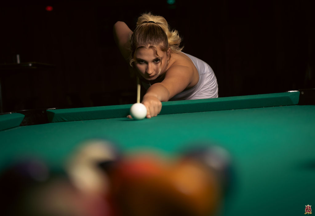 Woman shooting pool